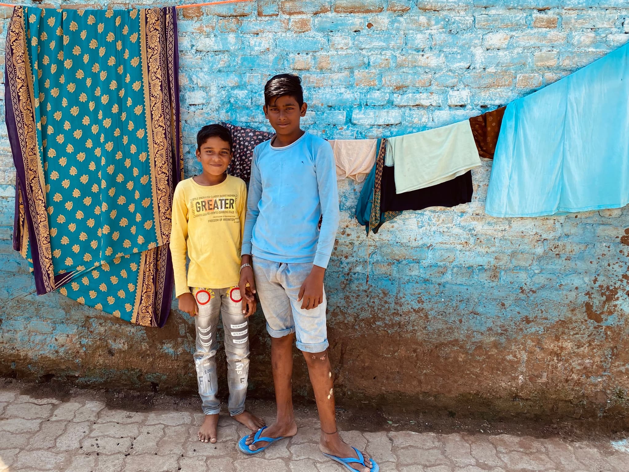 I saw these two loitering about in Jalgaon Jamod on a very hot day. They were staring at me from afar while I was taking photos so I struck up a conversation and captured this unique moment.